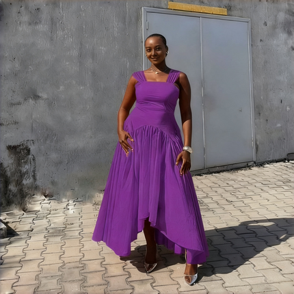 High-low pleated dress in purple with square neckline and draped asymmetrical skirt
