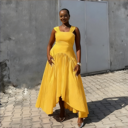 High-low pleated dress in yellow with square neckline and gathered asymmetrical skirt