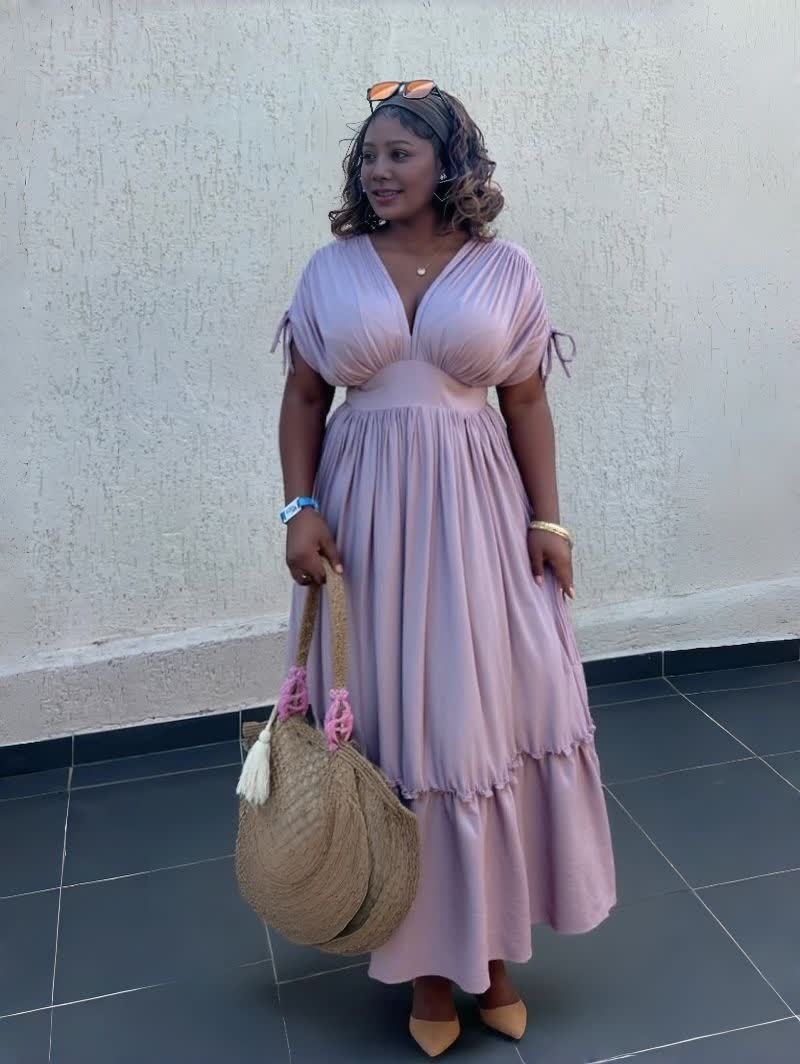 Light pink maxi dress with gathered waist and ruffled hem, V-neck, short tie sleeves