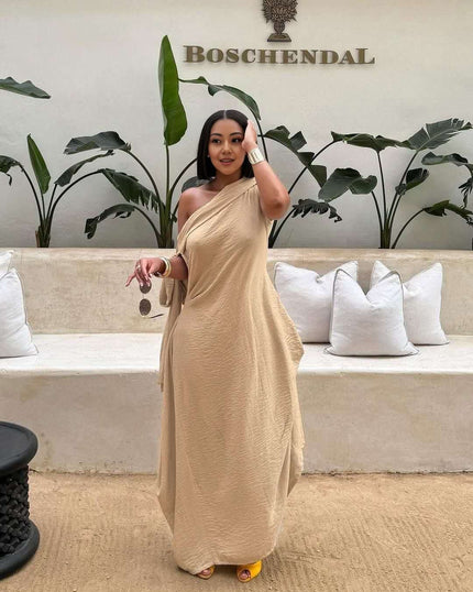 Nude one-shoulder maxi dress with layered loose fit and asymmetrical drape