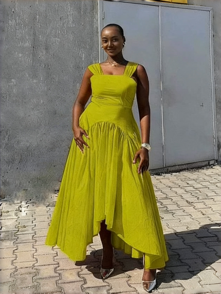 High-low pleated dress in yellow-green with square neckline and gathered asymmetrical skirt