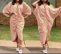 Beige geometric draped dress with V-neck, batwing sleeves, and side drape slit