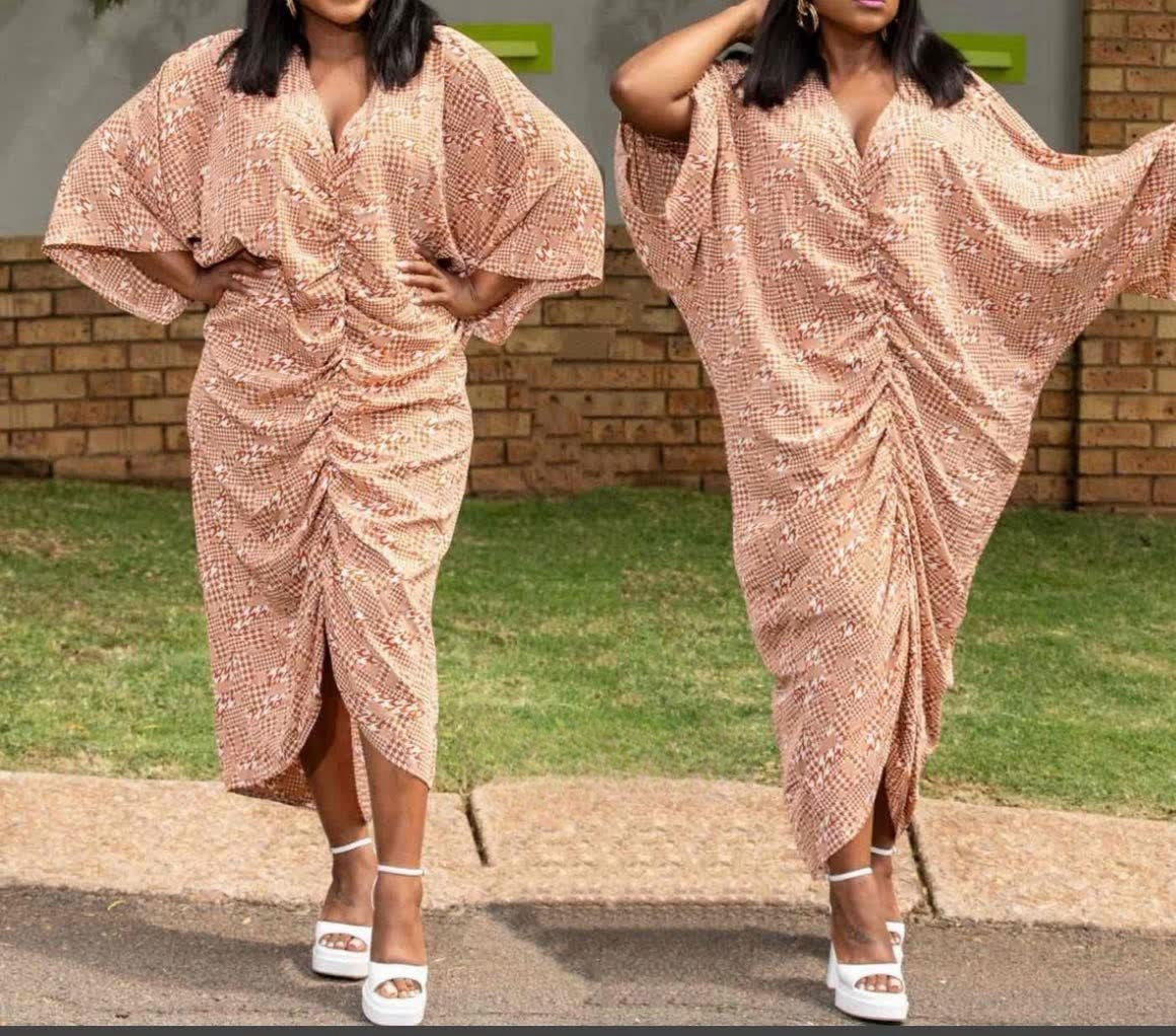 Beige geometric draped dress with V-neck, batwing sleeves, and side drape slit