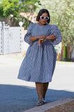 Blue-and-white striped puff-sleeve dress with gathered waist, knee length