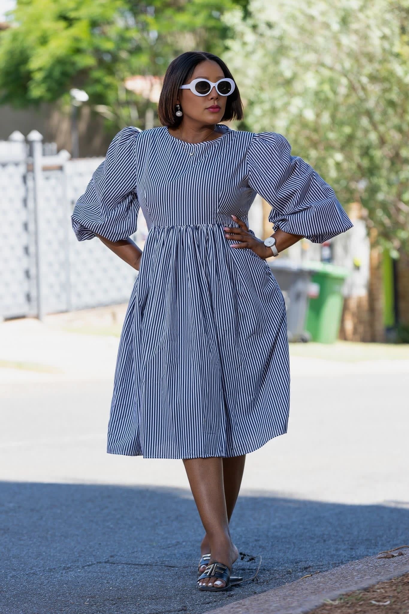 Blue-and-white striped puff-sleeve dress with gathered waist, full gathered skirt