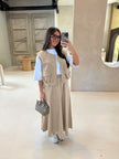 Beige twin set: utility vest with front straps and zip, paired with maxi skirt