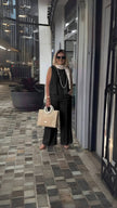 Black wide-leg pants with relaxed fit and wide flared legs