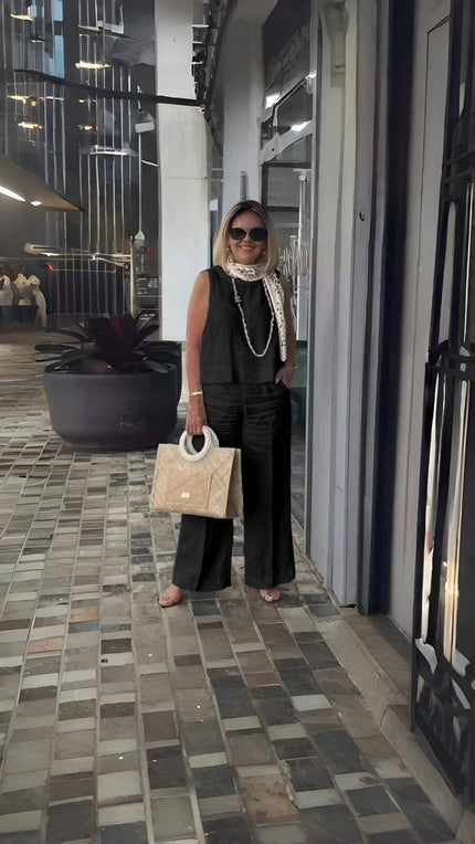 Black wide-leg pants with relaxed fit and wide flared legs