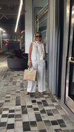 White wide-leg pants with relaxed fit and wide flared legs