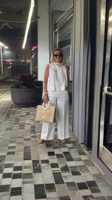 White wide-leg pants with relaxed fit and wide flared legs