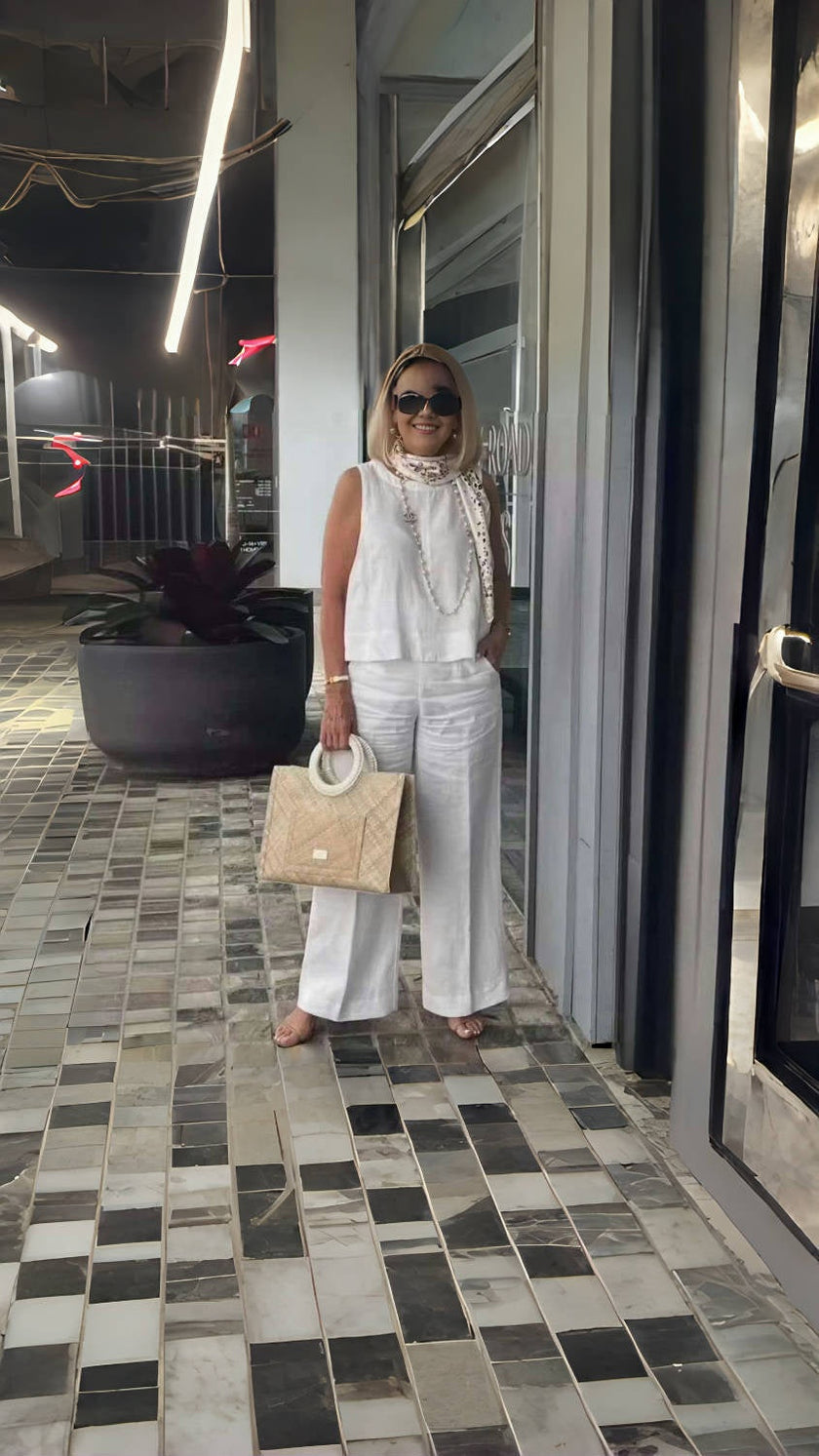 White wide-leg pants with relaxed fit and wide flared legs