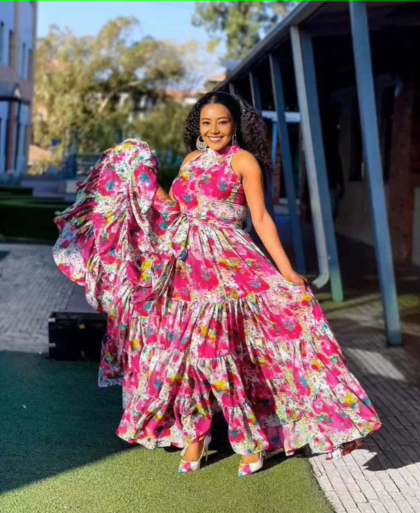 Pink sleeveless floral maxi dress with tiered ruffle skirt