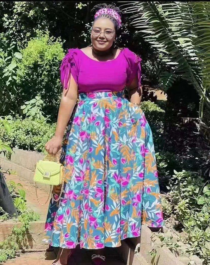 Puff-sleeve blouse and floral skirt twin set, purple top with multicolor leaf print
