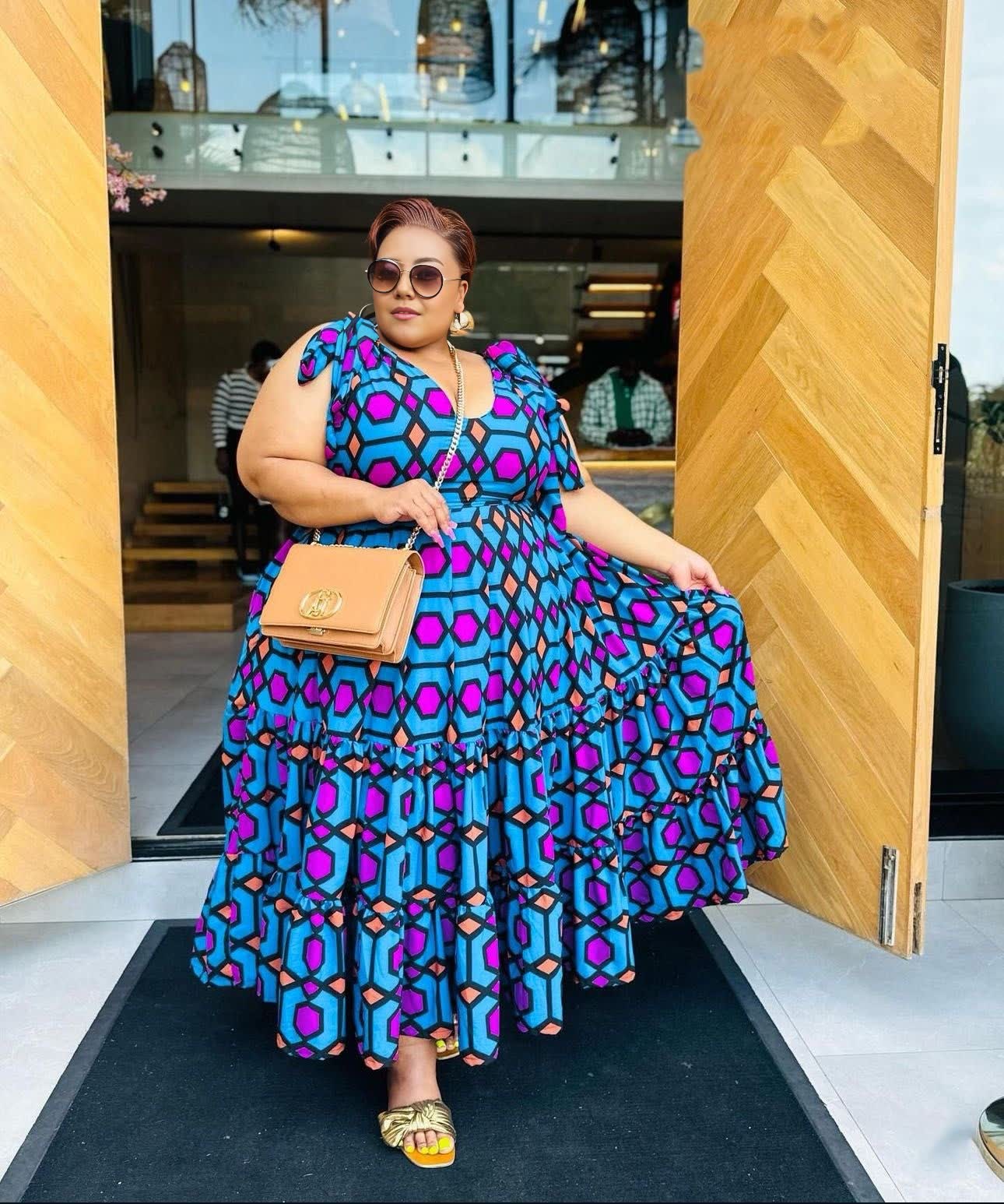 Plus size maxi dress with vivid geometric print, V-neck and tiered skirt