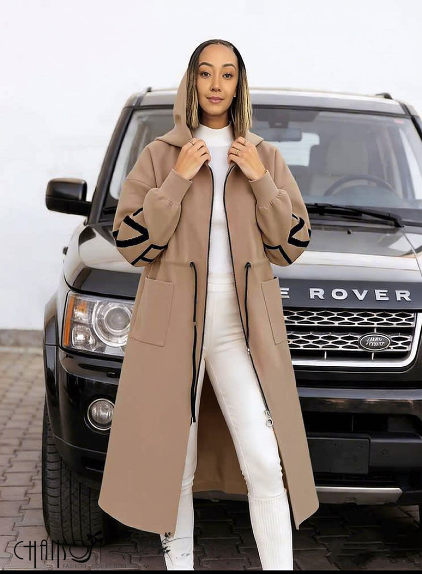 Nude hooded knit coat with front zipper, long length and geometric sleeve trim