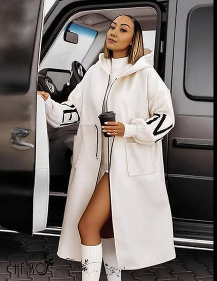 White hooded knit coat with front zipper, long sleeves, oversized hood