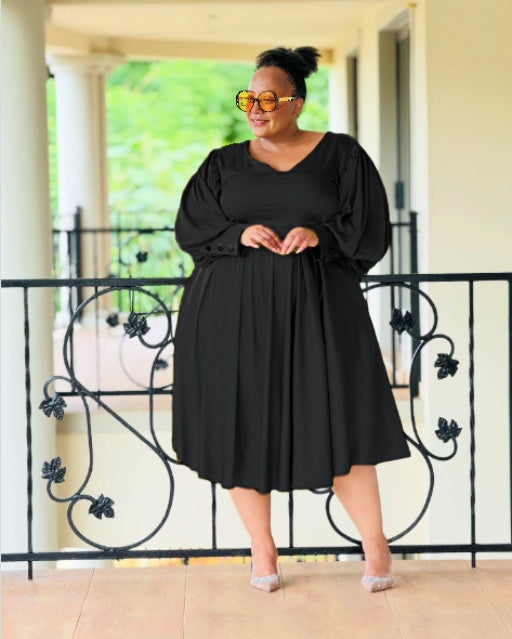 Plus size midi dress, black with puff sleeves and pleated, gathered skirt