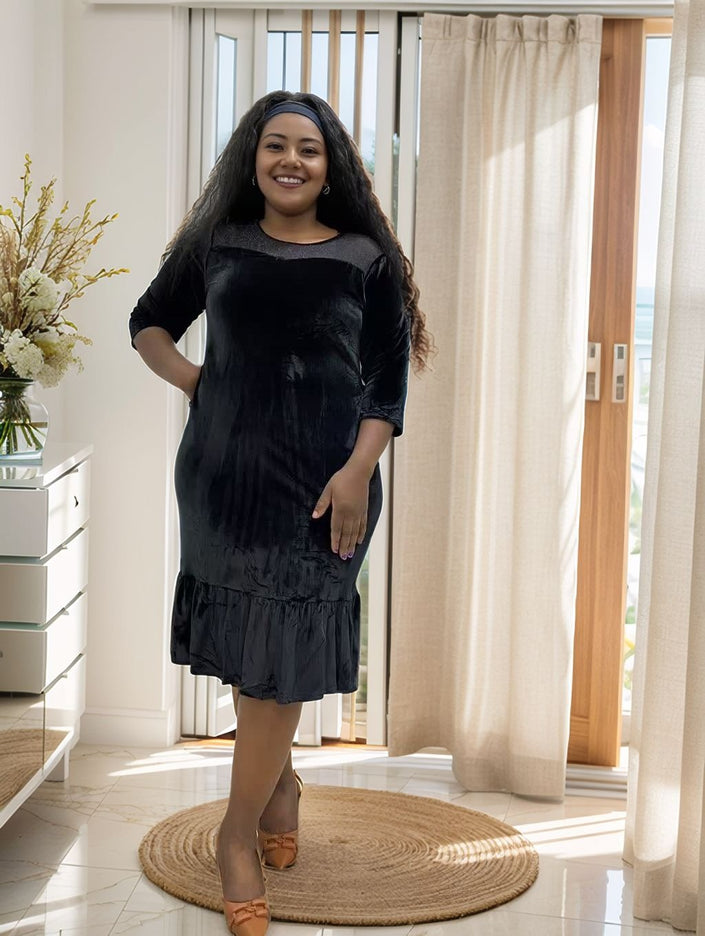 Black velvet midi dress with ruffle hem, three-quarter sleeves, plus-size fit