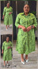 Green midi shirt dress with collar, button front, and abstract face print
