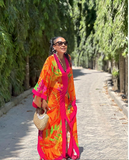 Tropical print maxi dress with V-neck and puff sleeves, colorful flowing fabric
