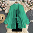 Twin set bodycon dress with green blouse, black fitted skirt underlay