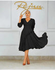 Black ruffle midi dress with long sleeves, V-neck, and textured side trim