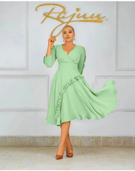 Light green ruffle midi dress with long sleeves, V-neck, and ruffled side detail
