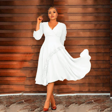 White ruffle midi dress with long sleeves, V-neck, and ruffled hem and side trim