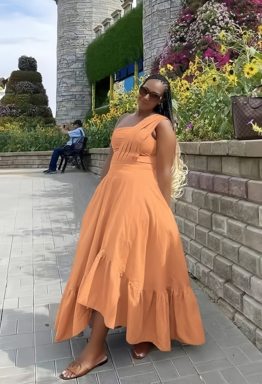 Orange one-shoulder midi dress with ruffle hem and flared skirt