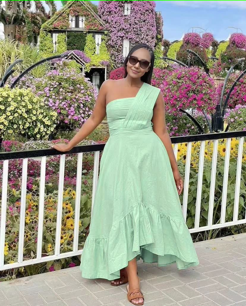 Light-green one-shoulder midi dress with ruffle hem and flared skirt