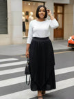 Black pleated maxi skirt, asymmetrical hem with layered drape