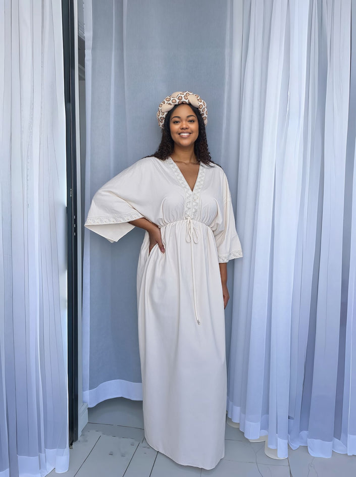 Cream maxi dress with V-neck button placket, loose wide sleeves, drawstring waist