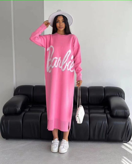 Pink knit maxi dress with long sleeves and white script logo front, crew neckline.