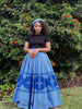Blue pleated flared maxi skirt with patterned hem and border
