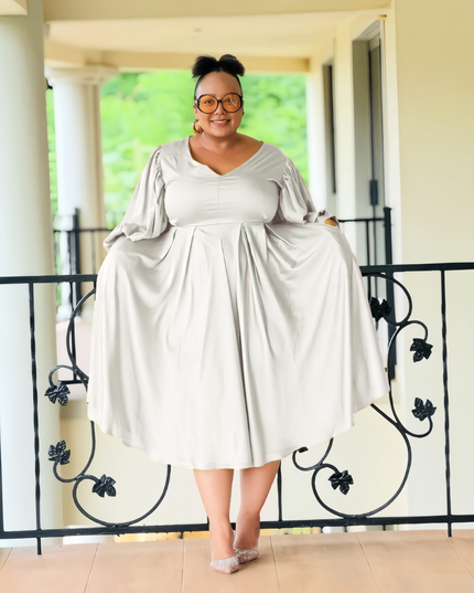 Plus size midi dress, white with puff sleeves and pleated, gathered skirt