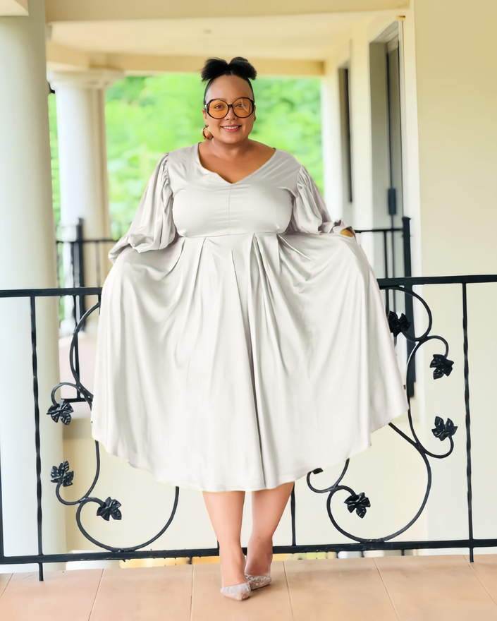 Plus size midi dress, white with puff sleeves and pleated, gathered skirt