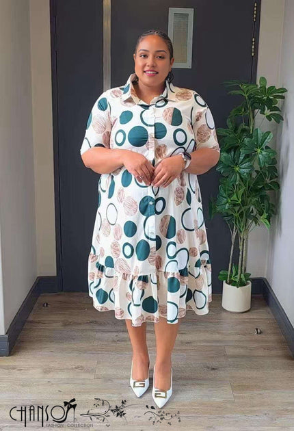 Plus size ruffle shirt dress with teal and brown dot print, collared button front