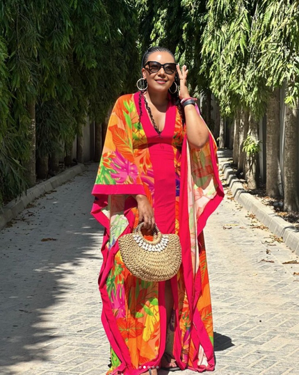Tropical print maxi dress with V-neck and draped puff sleeves, bold colorful pattern