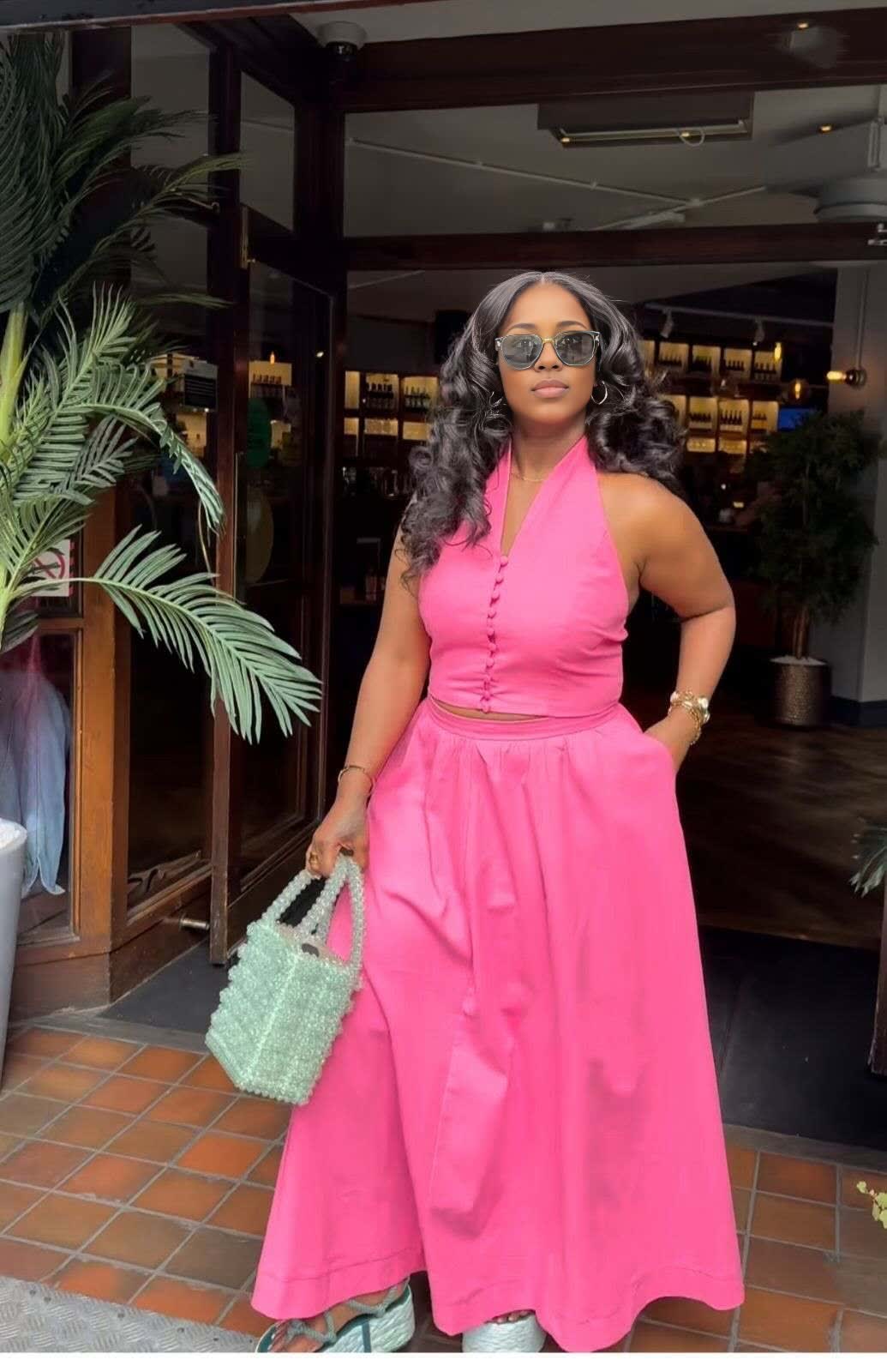 Hot-pink halter top and skirt set with fitted bodice and full midi skirt