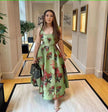 Green floral midi dress with adjustable spaghetti straps and fitted bodice