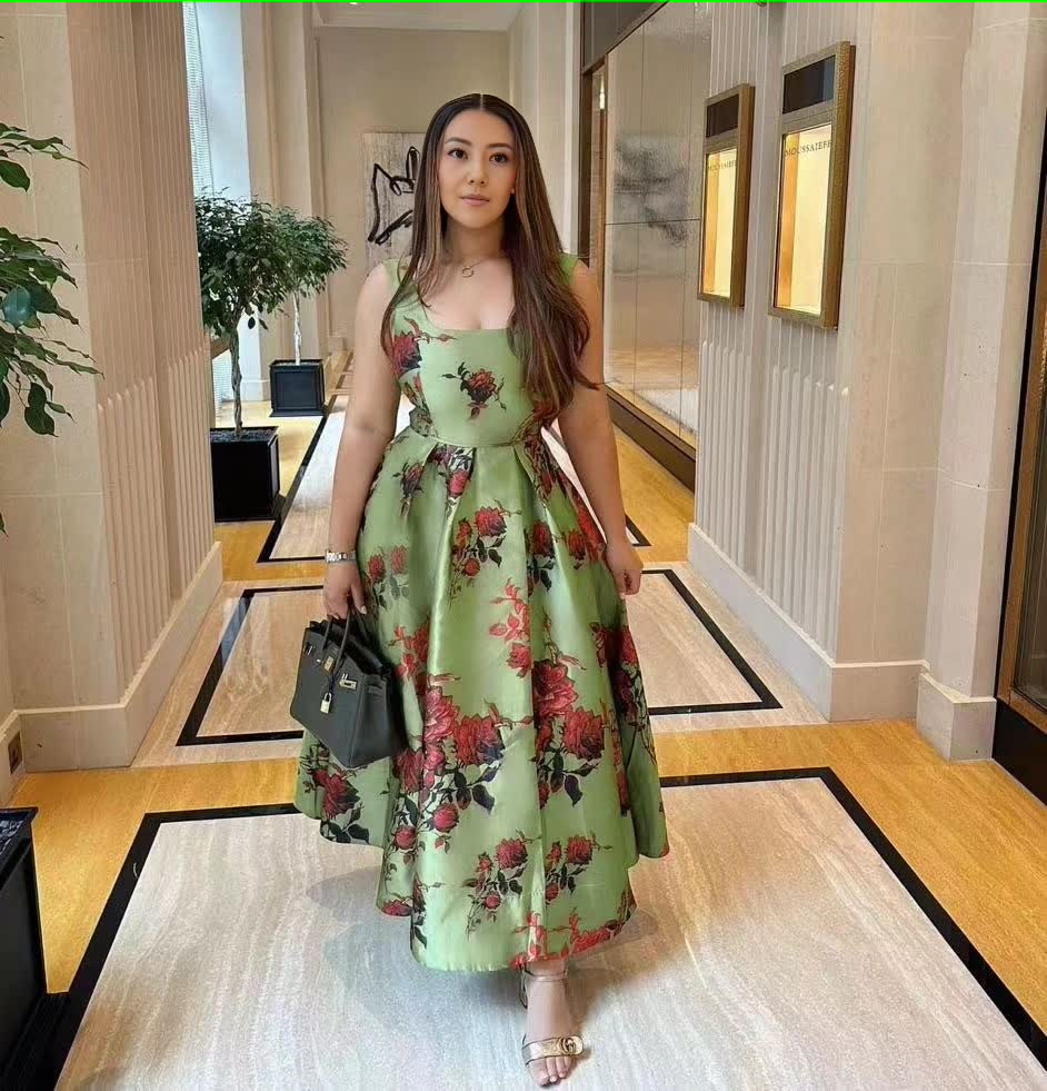 Green floral midi dress with adjustable spaghetti straps and fitted bodice