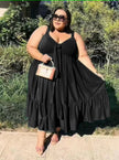 Plus size ruffle hem dress in black, sleeveless V-neck tie with tiered ruffle hem