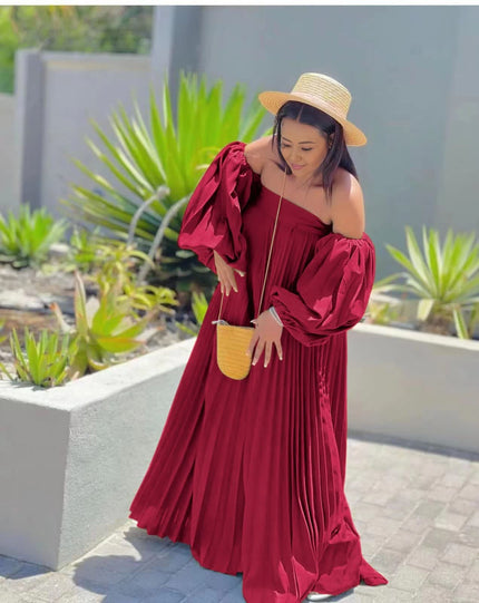 Off-shoulder pleated maxi dress, red puff sleeves.