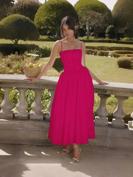 Deep-pink midi dress with thin straps, fitted bodice, and flared mid-length skirt