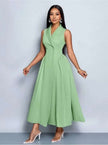 Mint green sleeveless midi dress with pleated A-line skirt and V-neck wrap bodice