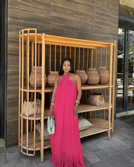 Hot-pink halter maxi dress with tassel fringe hem, draped neckline