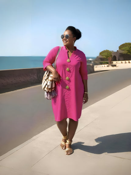 Hot-pink midi dress with long sleeves, button front, and round neckline.