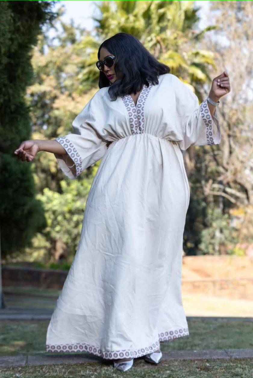 Geometric maxi dress with stretch waist, white with patterned trim at hem