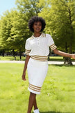 Knit top and skirt set with white fabric and gold striped trim, button-front top