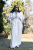 Geometric maxi dress, white with patterned yoke and trim along sleeve openings